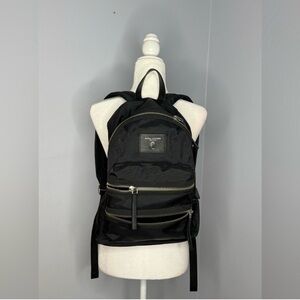 Marc Jacobs Sleek Black Backpack with Metallic Details.